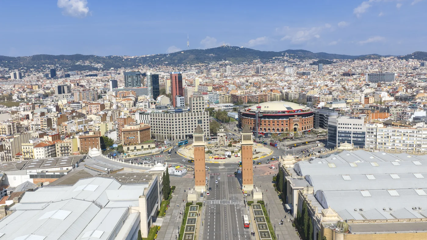 Barcelona from the air - the old bullring and twin towers at the head of a broad avenue