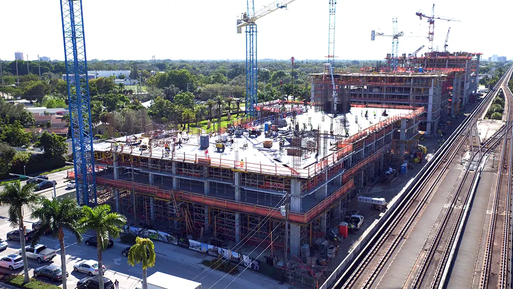 Tower cranes over a large mid-rise construction site in South Florida