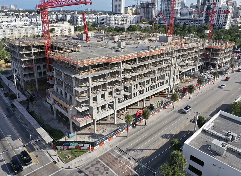 Mid-rise building under construction, photographed from the air