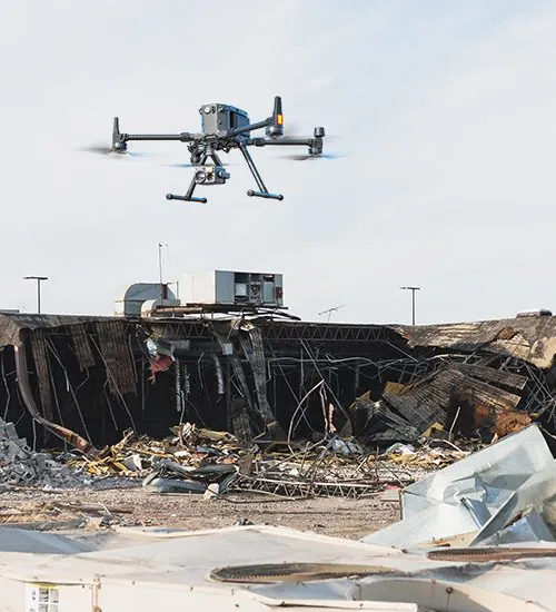 Close aerial view of a fire-damaged roof structure