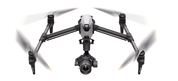 Cinema drone in flight with its rotors spinning