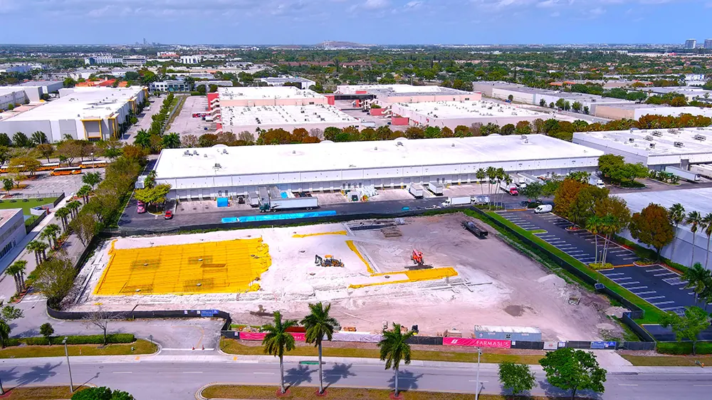 Aerial view of a commercial building site at ground-slab stage