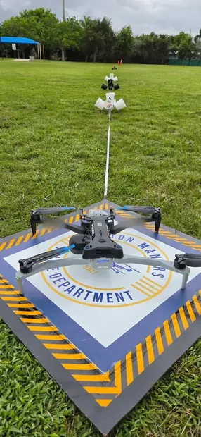Public safety drone on its landing pad beside a NIST standard test method lane